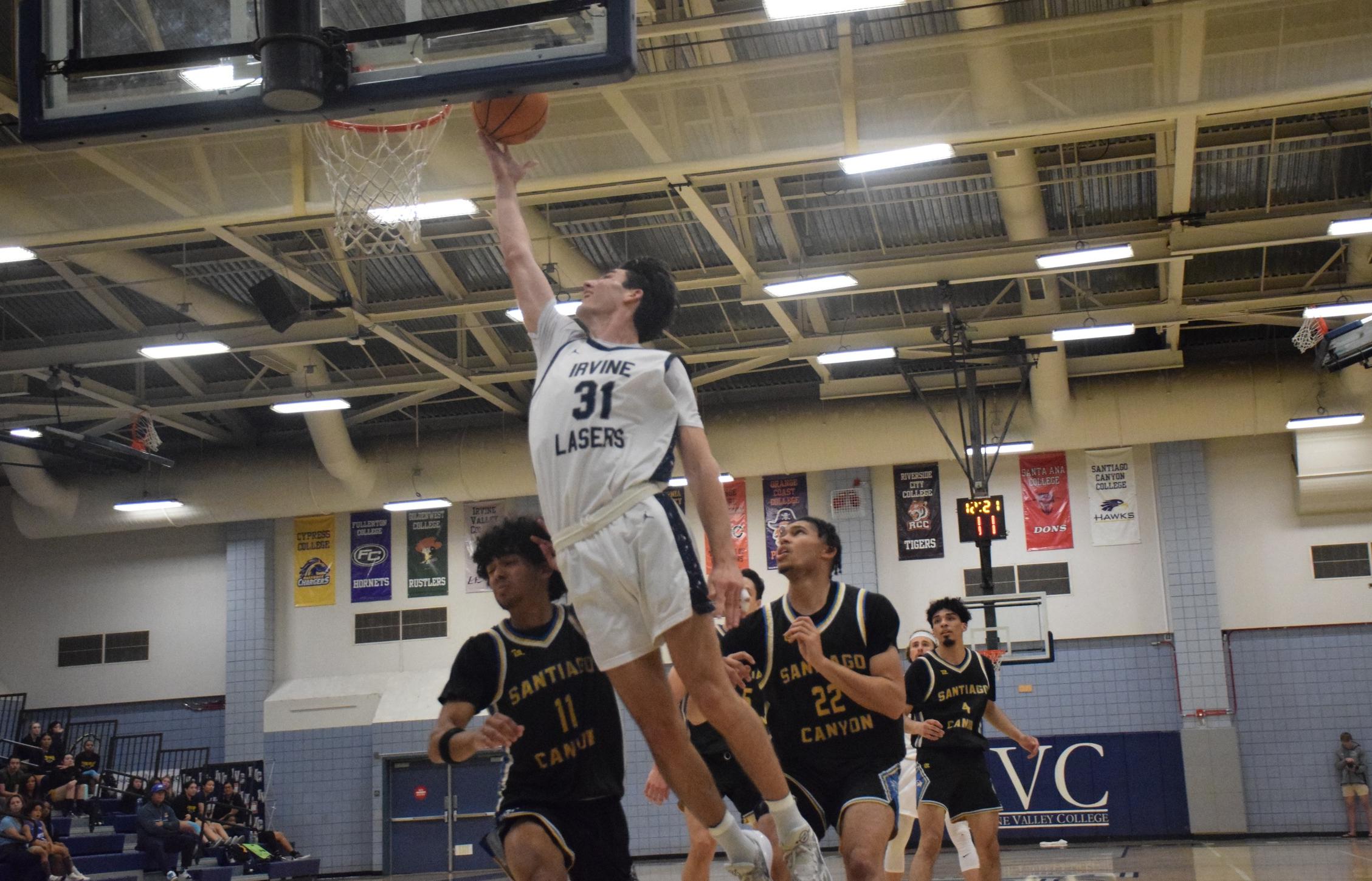Men's basketball team fights, but falls to Santiago Canyon