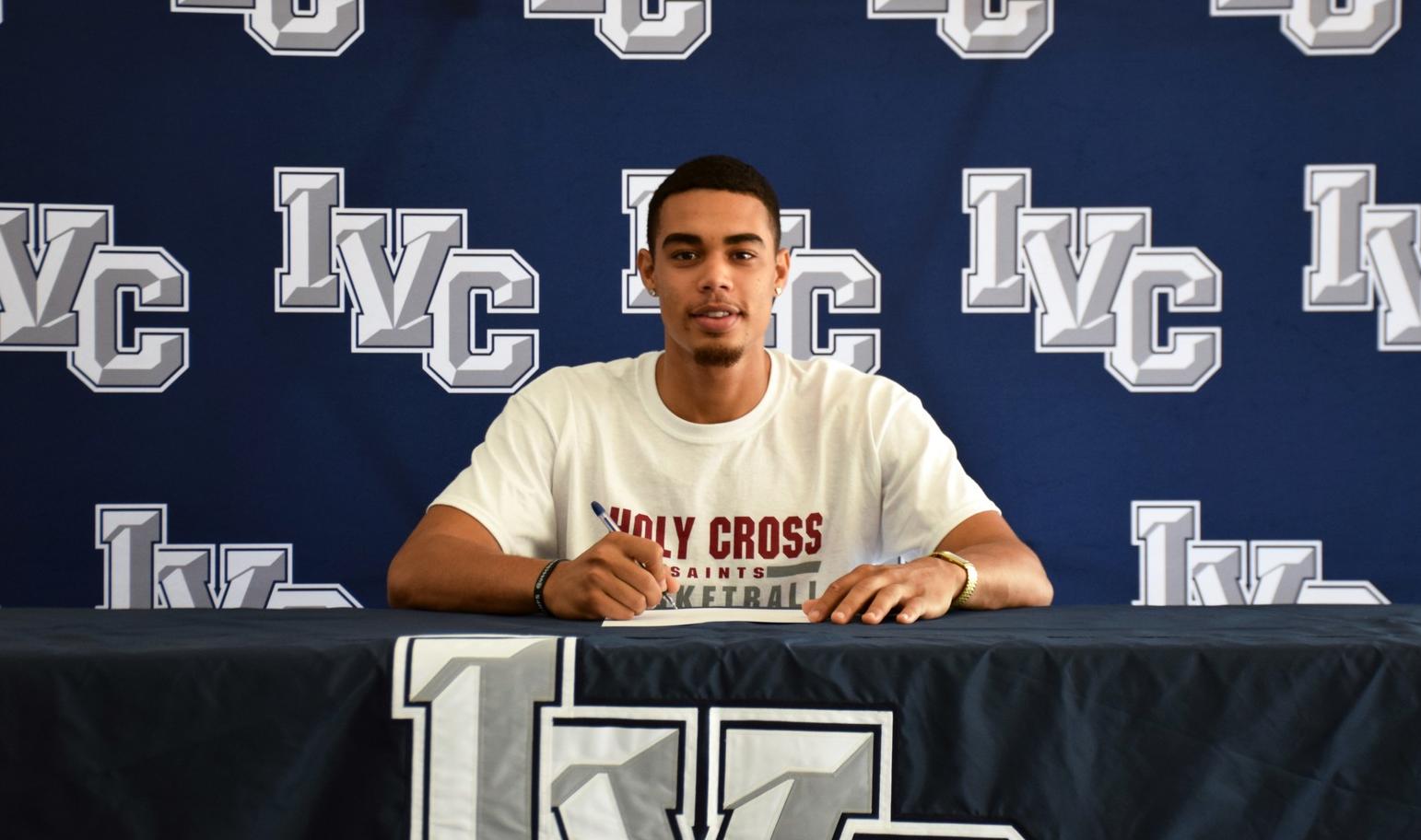 Basketball player Parker Sims signs with Holy Cross College